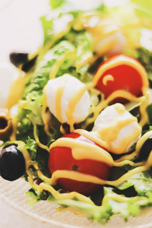 Food and diet, salad with fresh vegetables and mozzarella cheese as meal for lunch or dinner, tasty...