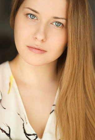 Beautiful woman looking at camera, natural make-up face portrait, lifestyle mood at home.の写真素材