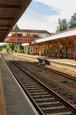 Victorian train station platforms and railway tracks in a tranquil setting on a sunny day. Kemble train station, Gloucestershire, Englandの写真素材