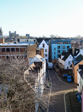 High angle view overlooking Oxford city street with diverse architecture, including traditional and...
