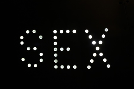 A sign made up of lightbulbs, reading sexの写真素材