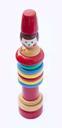 A vintage stacking toy, isolated on white, soft focus