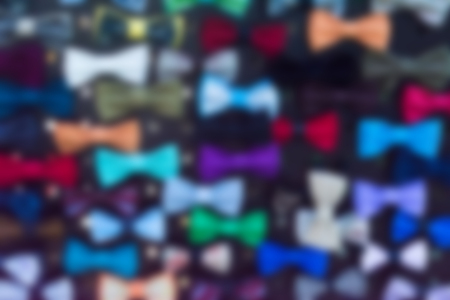 Blurred background with silhouettes colorful bow ties. Horizontal.の写真素材