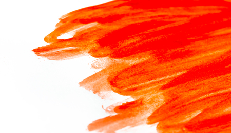 Texture of red watercolor paint on white paper. Horizontal background with stains of watercolour brush strokes. Rectangular photo.の写真素材