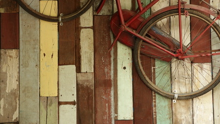 Vintage Old Bike on Colorful Wood Wallの写真素材