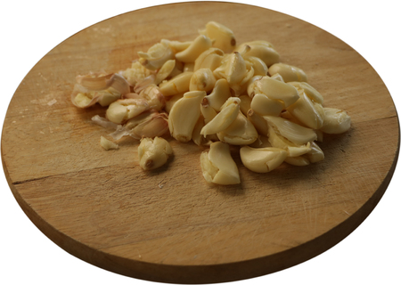 Smashed Garlic on Round Cutting Board - Isolatedの写真素材