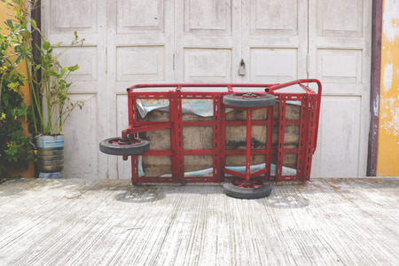 Red Tricycle Lying by Vintage Wall - Thailand