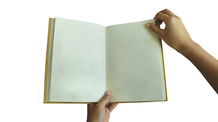 Female Hand Holding Blank Book/ Flipping Page on White Background - Real Vintage Paper Texture/ Yellow Hardbackの写真素材