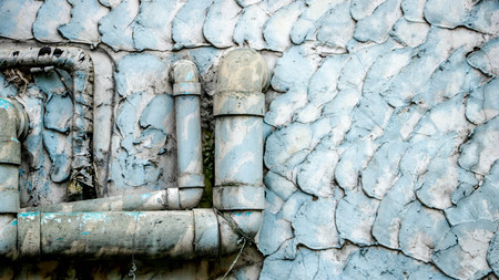 Old Dirty Water Pipes on Vintage Painted Wall Texture - Blue/ Teal Pastel. Outside local house in the countryside Thailand.の写真素材