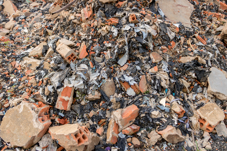 Big Heap of Concrete/ Cement Junk - Brick Wall Fragments with Plastic Garbage/ Trash - Construction. Asian Gardenの写真素材