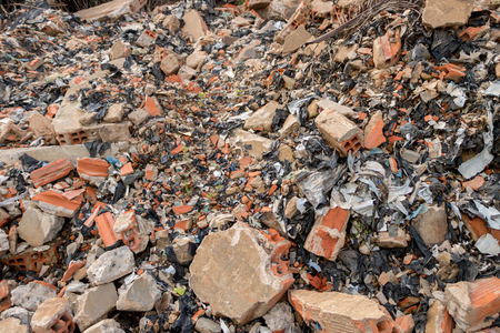 Big Heap of Concrete/ Cement Junk - Brick Wall Fragments with Plastic Garbage/ Trash - Construction. Asian Gardenの写真素材