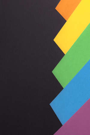 Minimalist black background, colored stripes on the side, copy space, vertical orientation.の写真素材