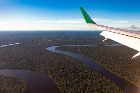 Amazonas river, view from the plane, wing of the plane, travel concept.の写真素材