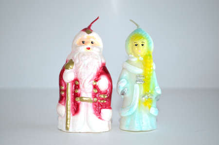 Grandfather Moroz and snow maiden. The candle.の写真素材