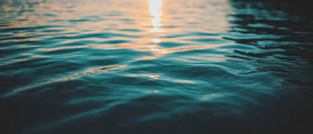 Calm river reflections at sunset creating a serene and peaceful atmosphereの素材