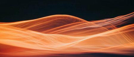 Flowing trails of fire light against a smooth black background in long exposureの写真素材