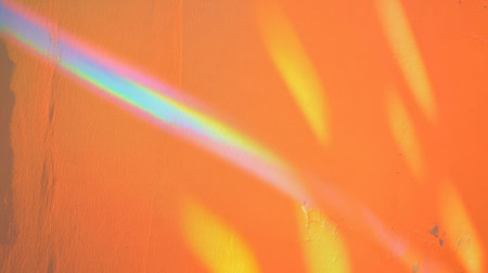 Prismatic orange yellow wall texture with rainbow reflection for designの素材