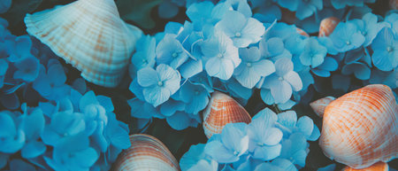 Beautiful blue hydrangeas mixed with seashells for a beach-inspired flat lay display