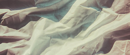 Linen paper with elegant texture showcasing a rich, tactile surface in soft lightingの素材