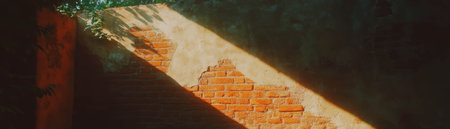 Brightly lit texture showcasing the intricate details of a brick wall with visible mortarの素材