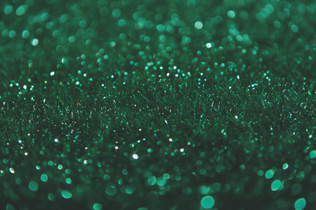 Dense wet grass texture with glistening droplets on dark background reveals natural beautyの素材