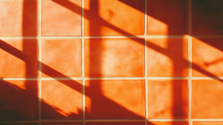 Warm orange tile pattern with dark grout in sunlight for interior background designの素材