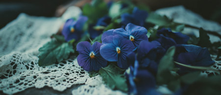 Delicate purple violets intertwined with antique lace in a graceful flat lay arrangementの素材