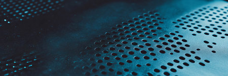 Detailed view of perforated leatherette with a textured zinc surface in a modern settingの素材