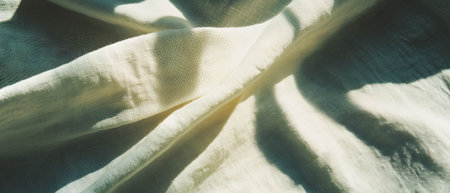 Soft and elegant linen texture showcasing natural woven details and subtle light patternsの写真素材