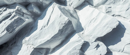 Textured light gray stone surface with cool and smooth appearance on a neutral backgroundの写真素材