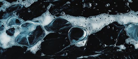 Water bubbles overlay on a black background creating structured patterns and formationsの素材
