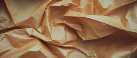 Light brown kraft paper texture showcasing roughness and visible fibers in a unique patternの素材