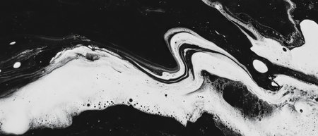 Ink patterns create dynamic textures on canvas surface with contrast and variationの素材