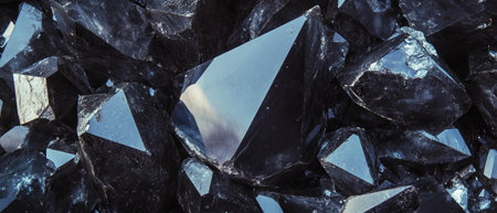 Obsidian displays sharp edges and glassy surface showcasing natural beauty and textureの素材