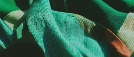 Varied textures of green fabric showcasing intricate woven patterns and rich huesの素材