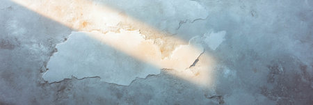 Exploring the intricate textures of Venetian plaster with natural side lighting effectsの素材