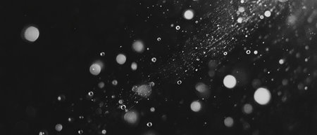 Bubbles floating upward create a captivating contrast against a dark backgroundの素材