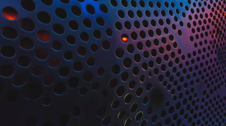 Vibrant colored light patterns on metal mesh wall - creative design for modern architectureの素材