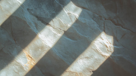 Natural limestone surface with varied grey and brown textures for background designの素材