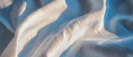 Textured linen fabric in soft, elegant hues creating a serene atmosphereの素材