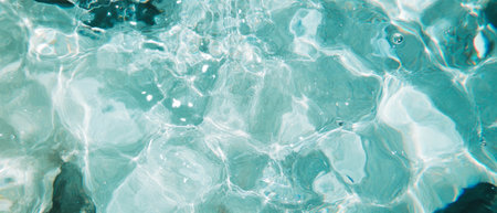Calm clear water surface with gentle ripples creating a serene textureの素材