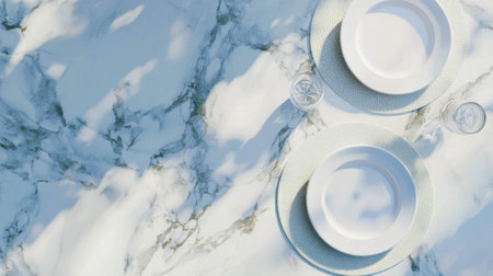 Elegant dining setup on a realistic marble table with two plates and glassesの素材