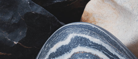 Exploring bold textures and contrasting colors in natural stones at a rocky siteの素材