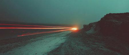 Ethereal light trails create dynamic patterns on a dark backgroundの素材