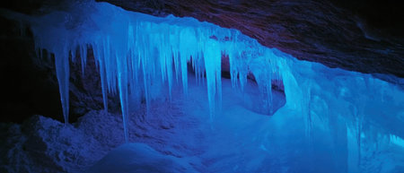 Mystical blue ice formations in an enchanting ice cave reveal natures wonder