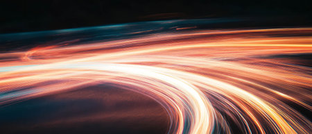 Dynamic fire trails create flowing patterns against a dark background in long exposureの素材