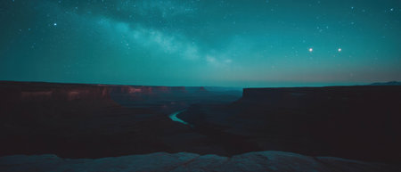 Vast canyon under a starry night sky reveals the beauty of the universeの素材