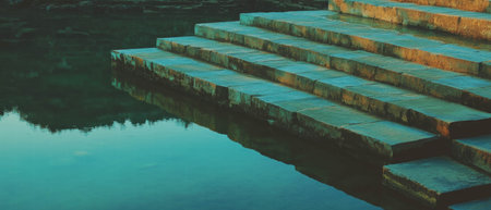 Reflections in the serene waters of Chinese rice terraces at duskの素材