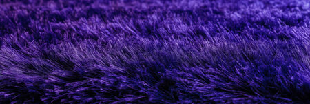 Deep purple carpet texture showcasing dense cut and loop design with varied pile heightsの素材