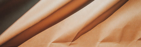 Light brown textured paper with diagonal lines showcases a subtle, fine patternの素材
